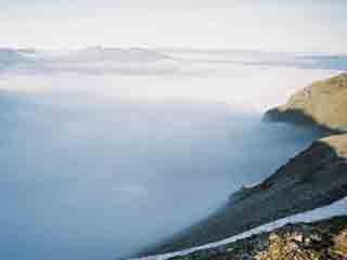 Fog blankets fjord to Kvannfjell (From Vassbruna range, Norway) (APS)