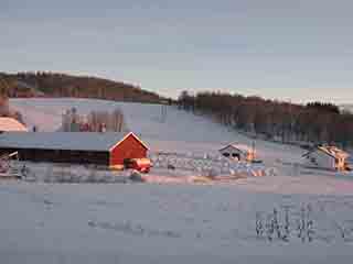 Snowy farm ready with hay stockpile (Near Josefvatnet, Norway)