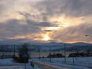 Divine veiled sunset watches over Sand (From Sand, Norway)