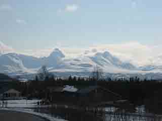 Winter clouds blanket Piggtinden (From Josefvatn, Norway)