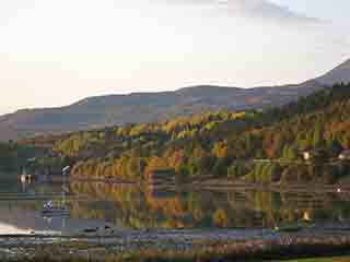 Autumn gently mirrored in the cove (Near Mestervik, Norway)