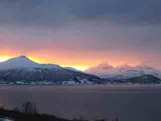 Lavafire sunset over Fugltinden (wide) (From Bergneset, Norway)